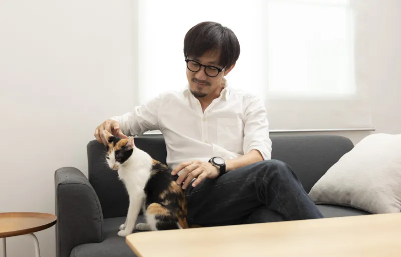 A landlord petting a tenant's emotional support cat